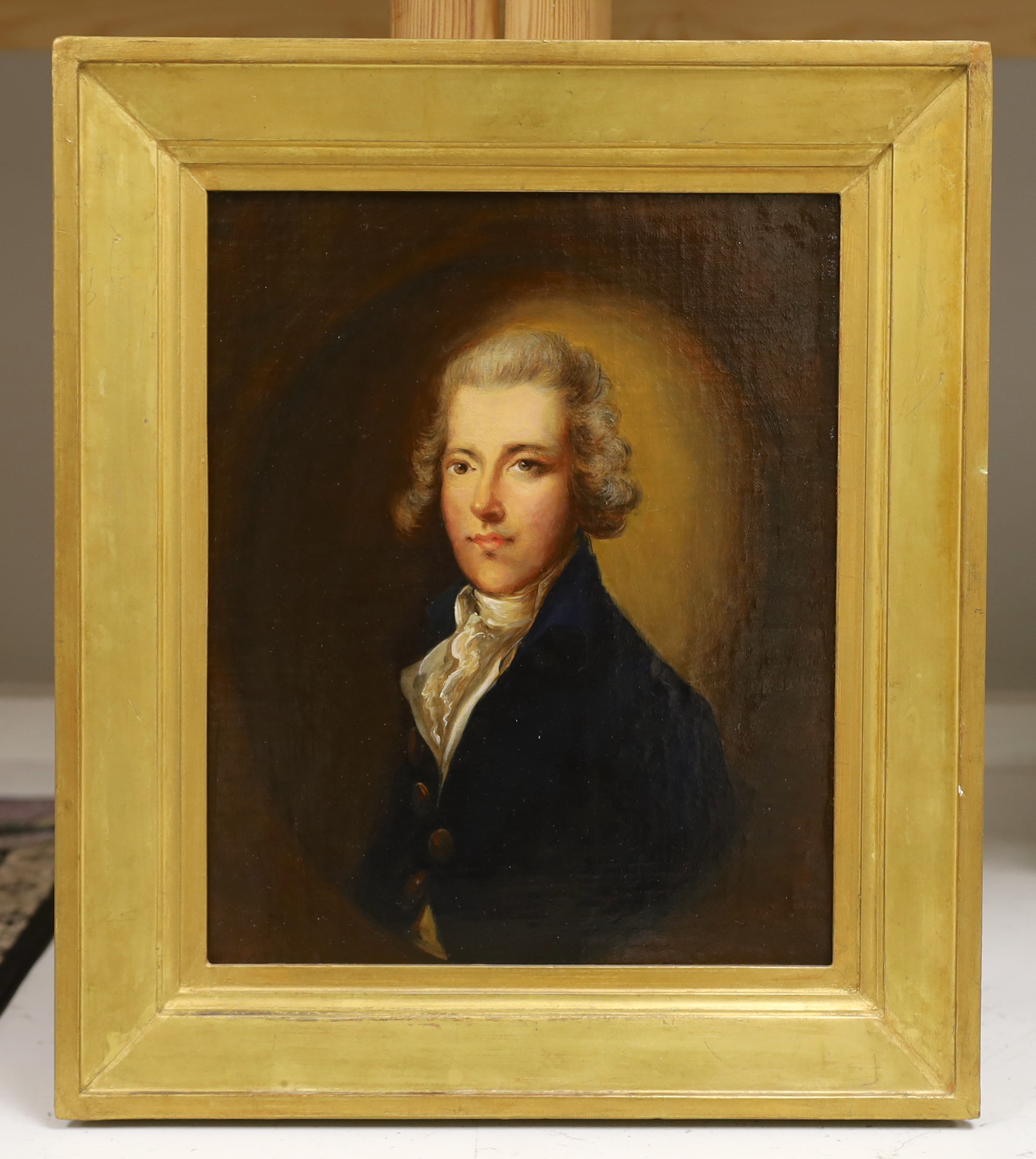 An 18th century / 19th century oil, portrait of a gentleman wearing a frock coat, in feigned oval, 26 x 21cm, gilt framed